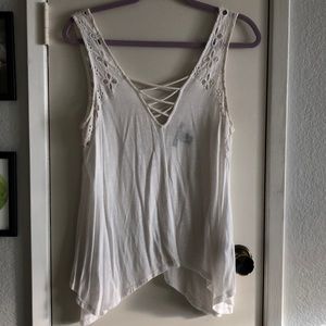 White eyelet trim asymmetrical hem top